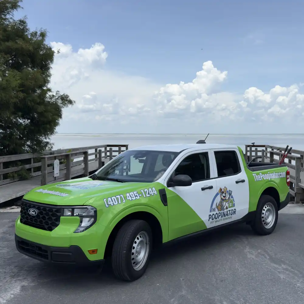 The Poopinator truck parked at a lakefront boardwalk in Winter Garden, FL.